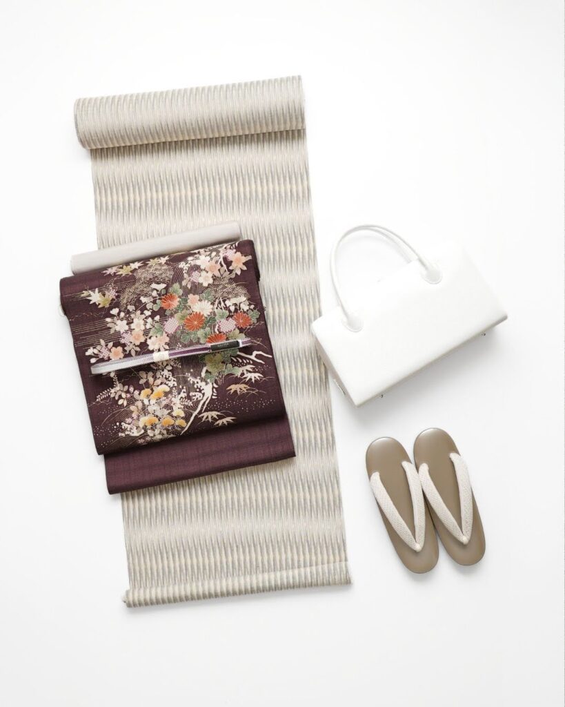 奥順 石下結城縮と成謙別注の御所解帯のコーディネート